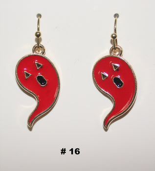 Red and gold earrings with a face design