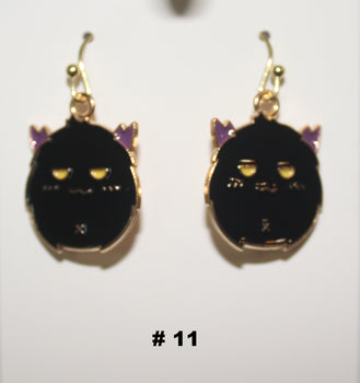 Black cat-shaped handmade earrings with gold accents 