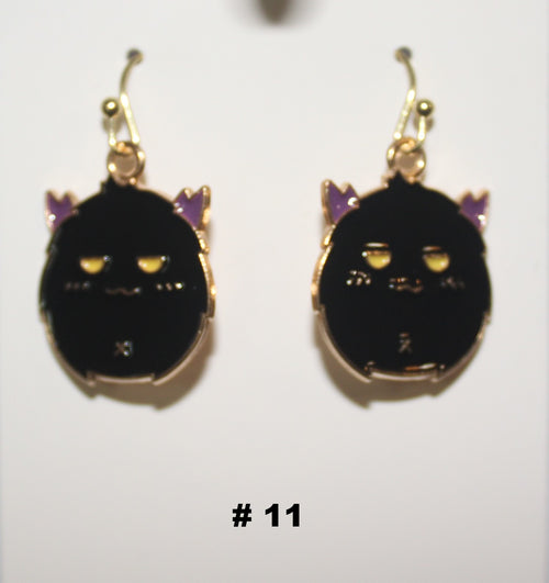 Black cat-shaped handmade earrings with gold accents 