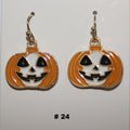 Halloween-themed pumpkin earrings with jack-o'-lantern faces 
