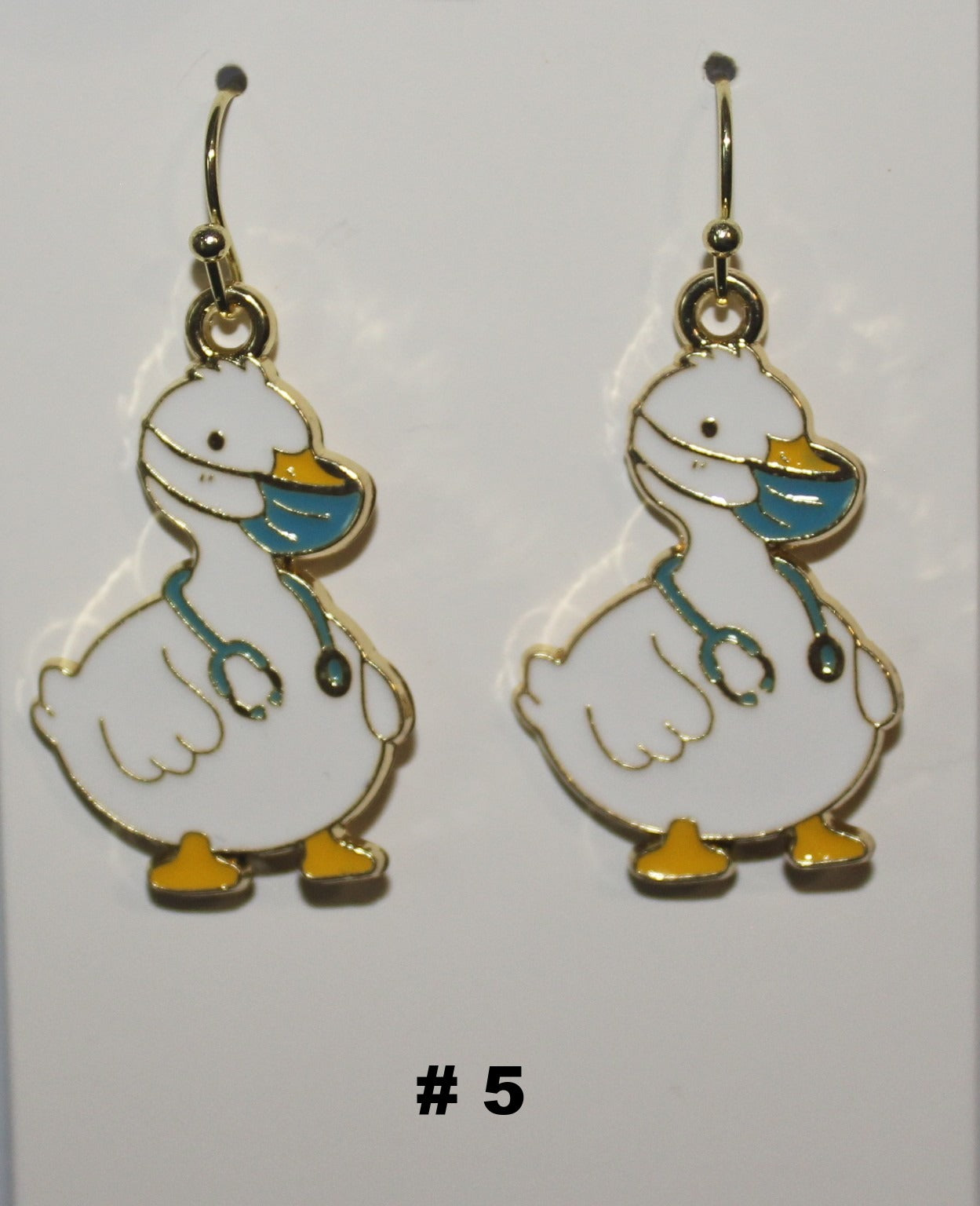 Pair of duck-shaped earrings with face mask