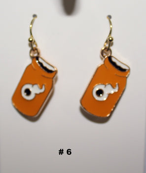 Orange jar-shaped handmade earrings with a small figure 