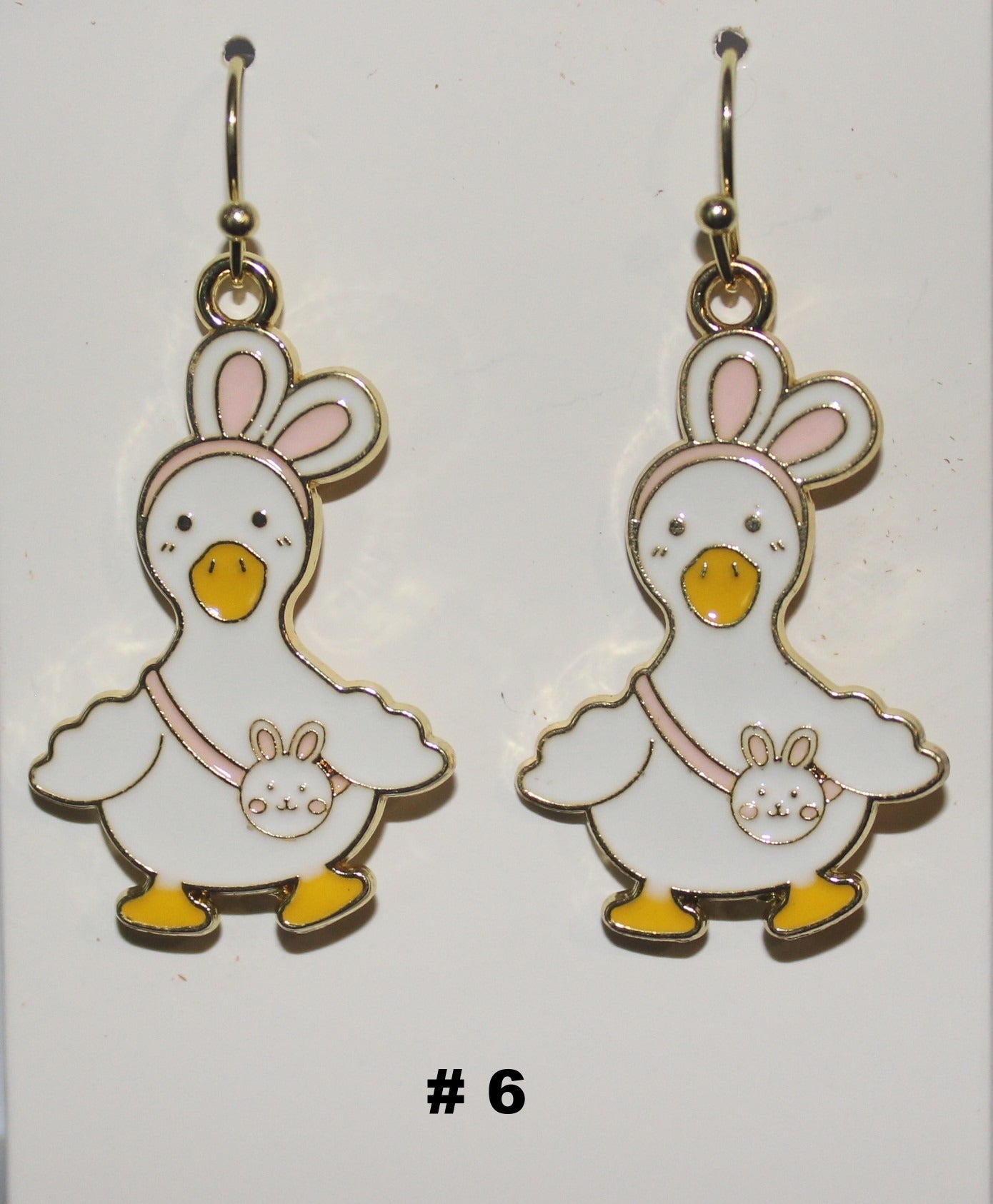 Pair of duck shaped earrings with bunny ears
