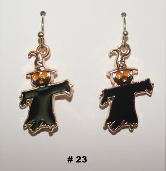 Halloween-themed earrings with black figures and orange accents 