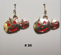 Pumpkin-shaped earrings with red faces 