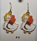 Pair of duck shaped earrings with bread