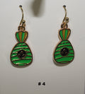 Green and gold earrings with a black center 