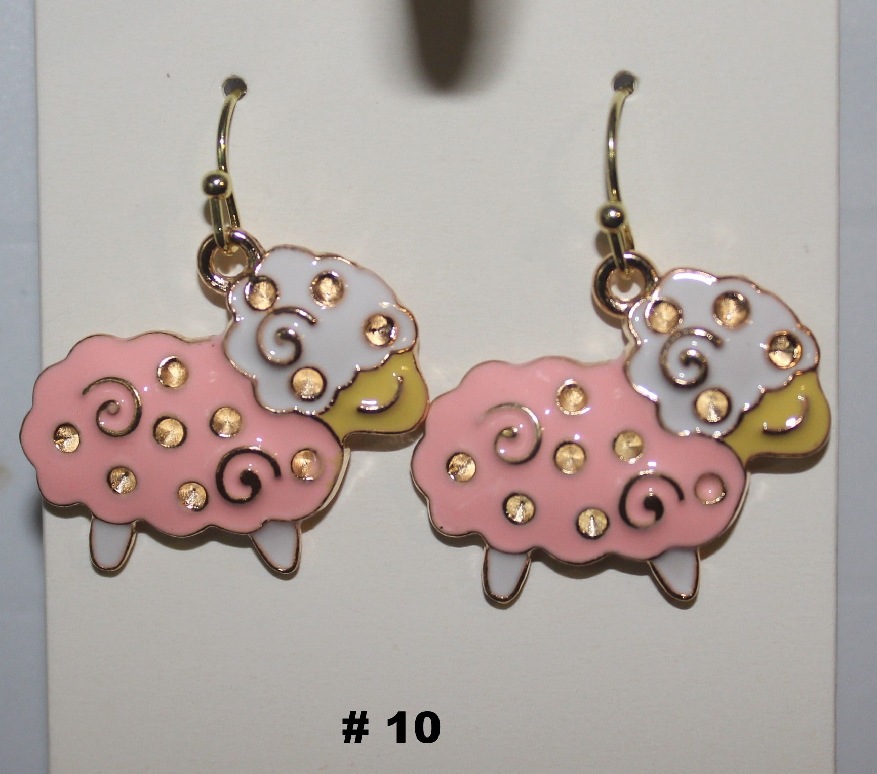 Sheep-shaped earrings with pink, white, and gold colors