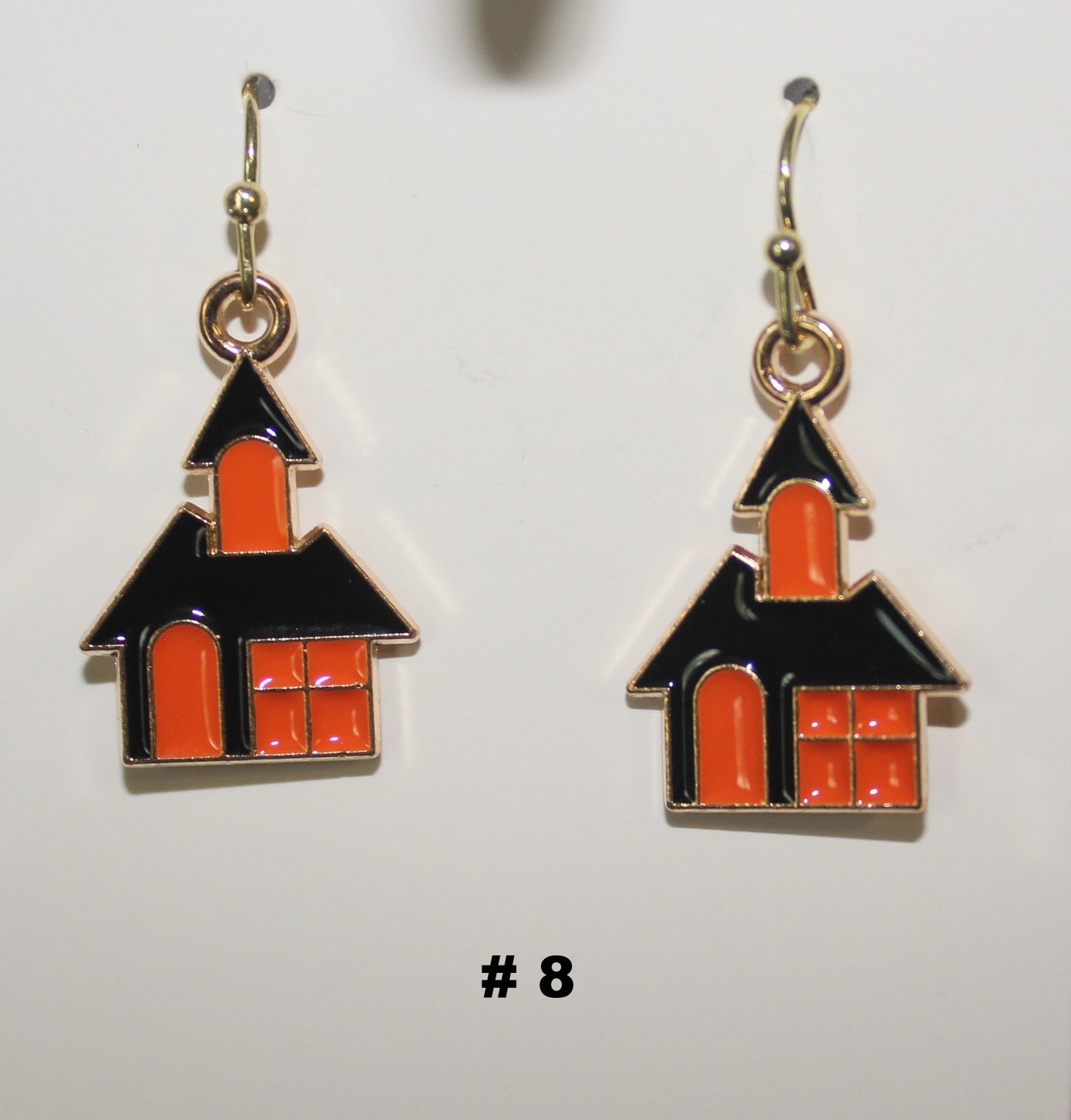 House shaped handmade earrings with black and orange design 