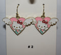 Heart-shaped earrings with a cartoon character 
