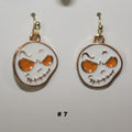Pair of handmade ghost head earrings with skull design 