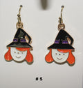 Witch themed handmade earrings with black hats and orange hair 