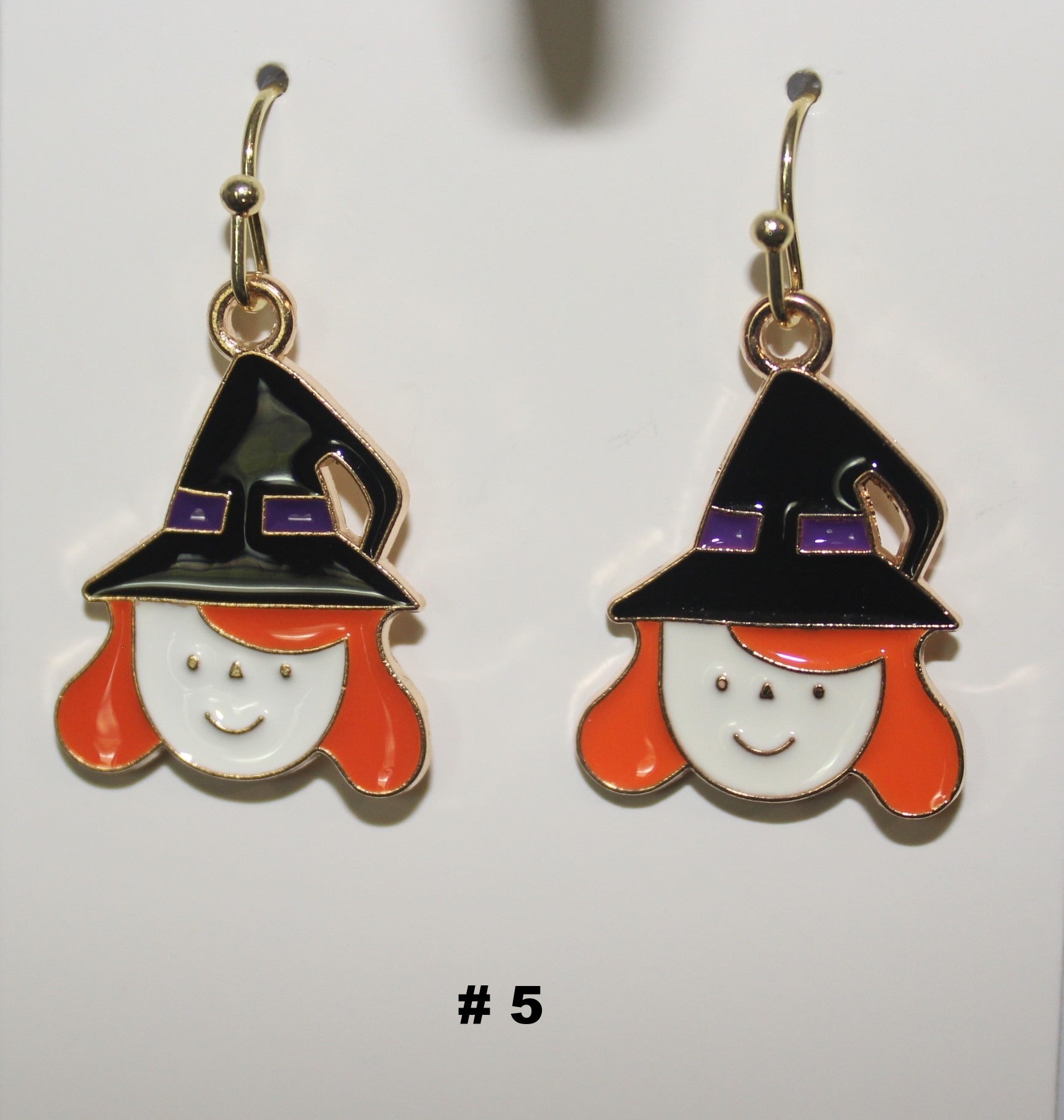 Witch themed handmade earrings with black hats and orange hair 
