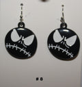 Black and white skeleton face earrings 