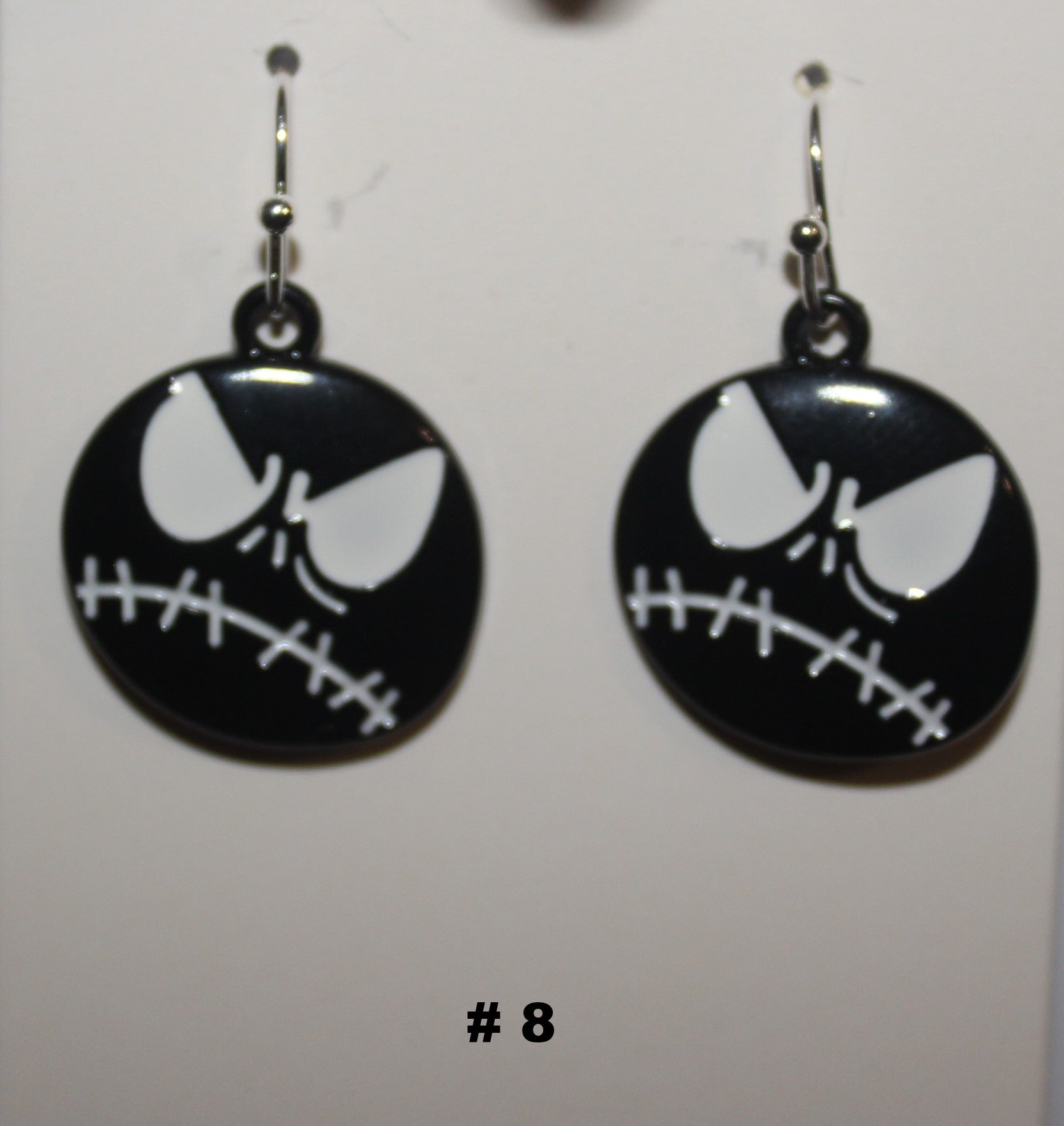Black and white skeleton face earrings 