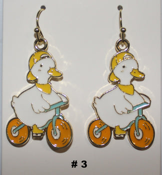Pair of duck riding bikes earrings