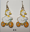 Pair of duck riding bikes earrings