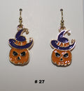 Halloween-themed pumpkin earrings with witch hats 