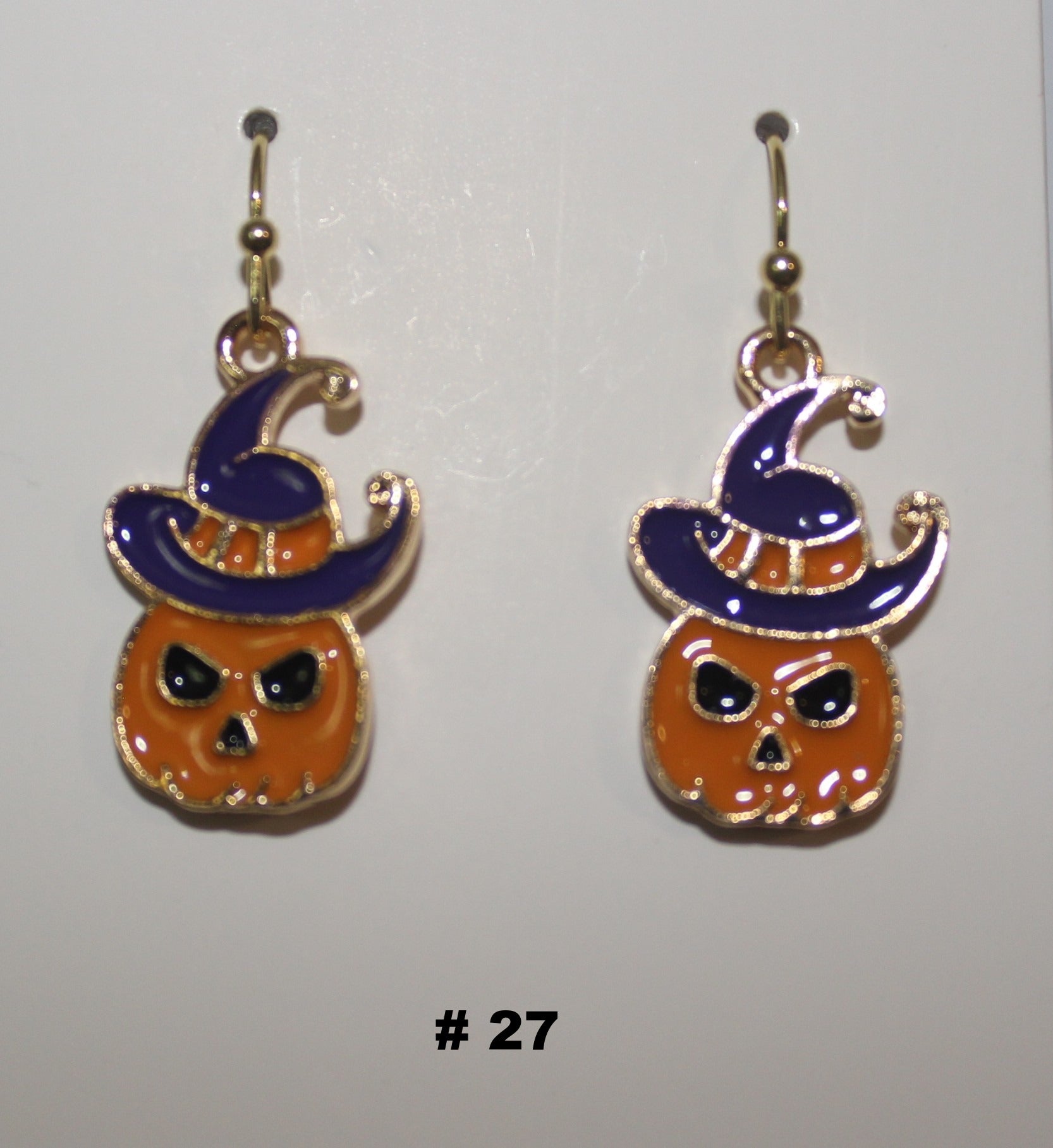 Halloween-themed pumpkin earrings with witch hats 
