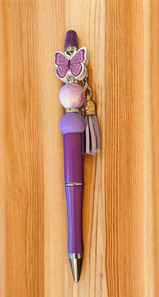 Red pen with butterfly charm and tassel