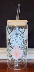 Glass jar tumbler with decorative clock and floral design 