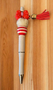 Decorative pen with red and white accents 