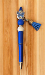 Red pen with butterfly charm and tassel