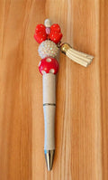 Decorative pen with red and white accents 