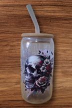 Clear glass tumbler with a skull and floral design 