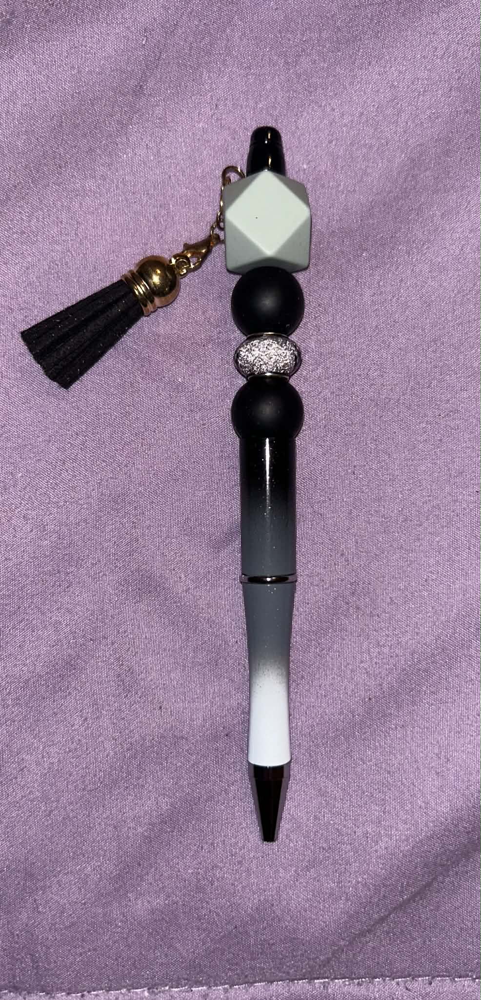 Decorative pen with beads and a tassel 