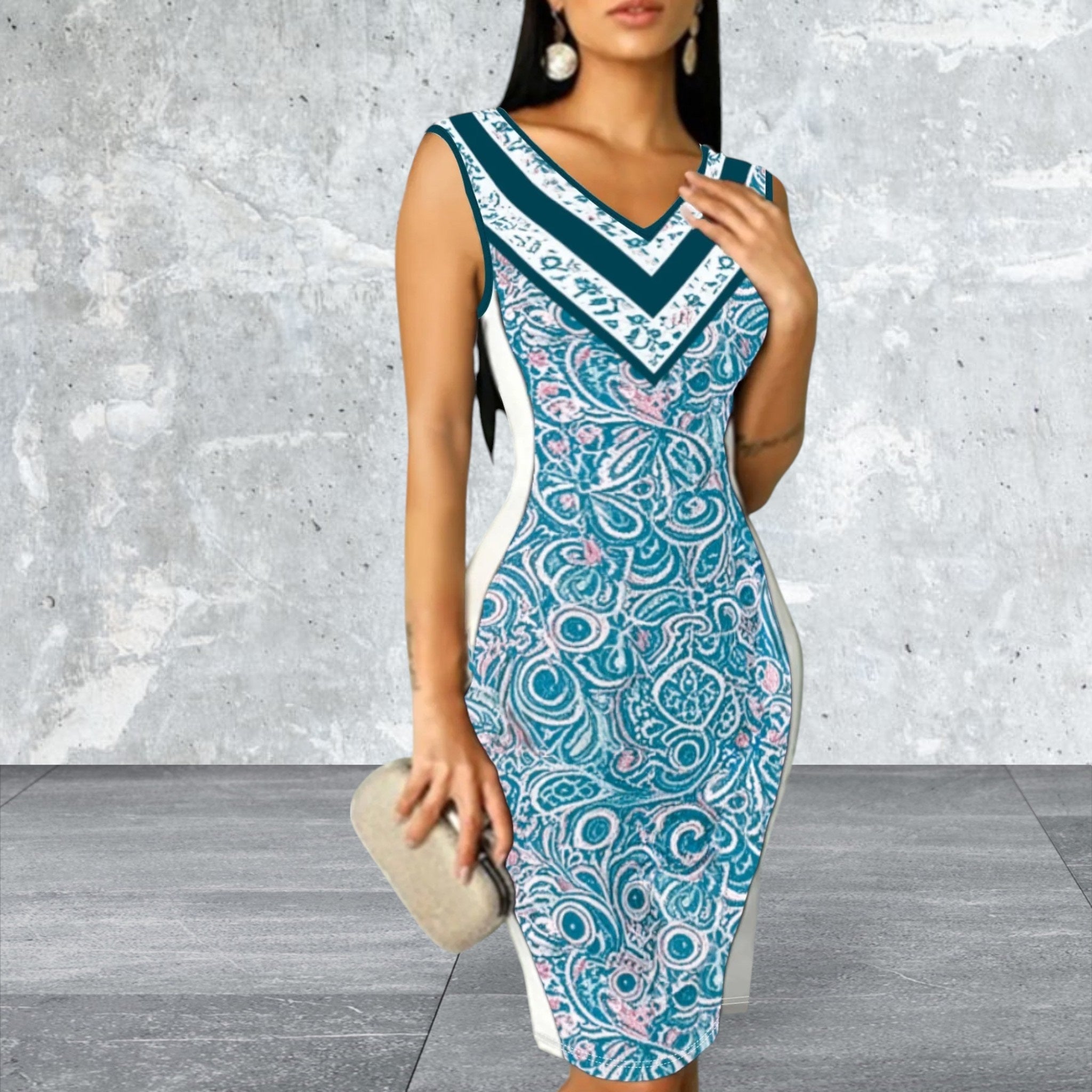 Woman wearing a blue patterned dress against a gray textured wall.