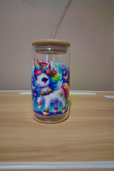 Glass cup with a colorful unicorn design 