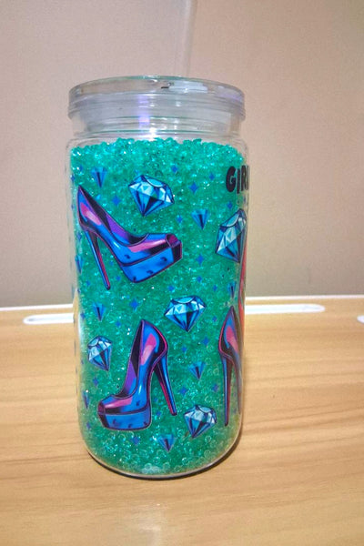 Tumbler with colorful design featuring lips and money