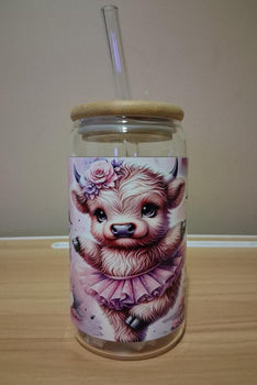 Glass jar with a straw lid featuring a cute animal illustration 