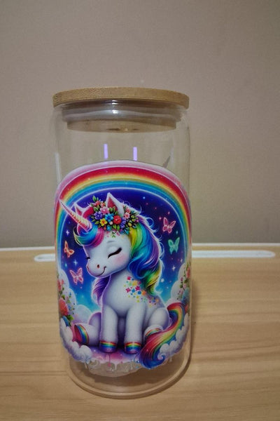 Glass cup with a colorful unicorn design 