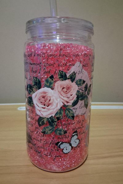Tumbler with floral design and text