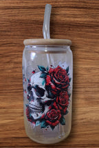 Glass cup with skull designs all around