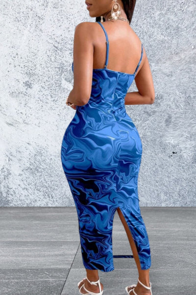 Woman wearing a blue patterned dress with a gray background