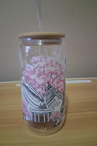 Clear tumbler with a bamboo lid and architectural design