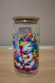 Glass jar with a colorful unicorn design 