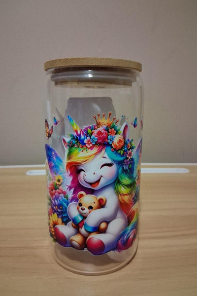 Glass jar with a colorful unicorn design 