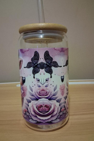 Glass cup with glass straw and bamboo lid featuring a cute animal illustration