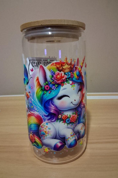Glass jar with a colorful unicorn design 