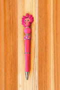 Pink pen with a cartoon character top 