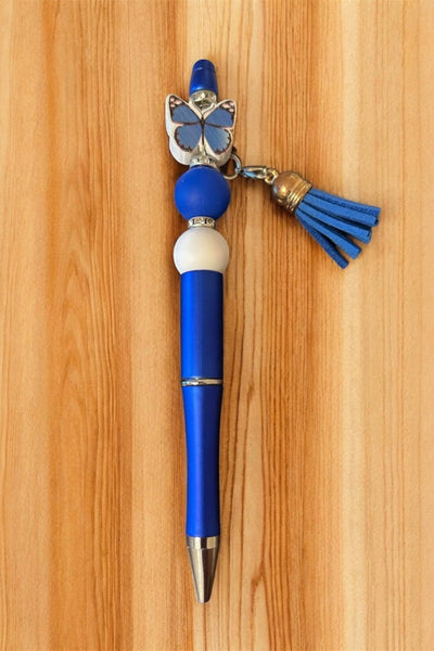 Red pen with butterfly charm and tassel