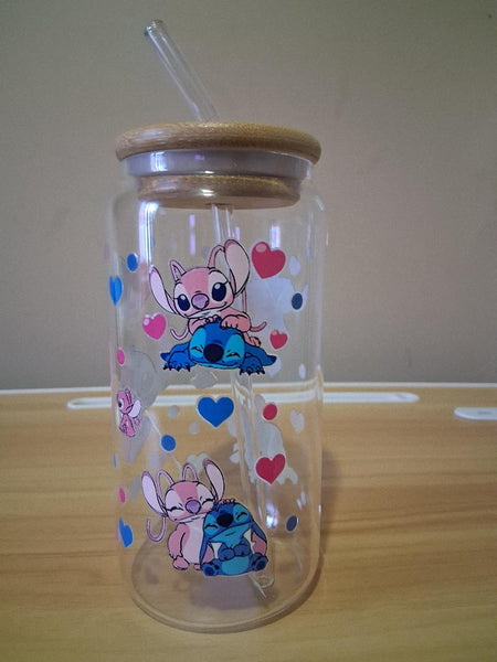 Clear tumbler with cartoon character design and heart patterns